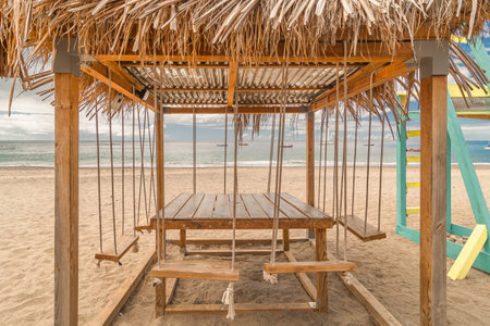 Wooden swing on the beach in the Carbet beach in La Martinique, Caribbean Sea, French West Indies.の写真素材