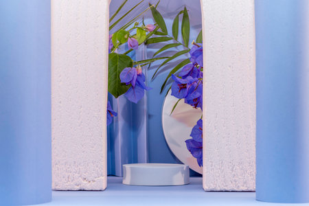 Blue flower in vase on shelf with white and blue wall backgroundの写真素材