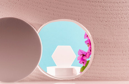 Round podium and pink orchid flowers on blue background. Minimal conceptの写真素材