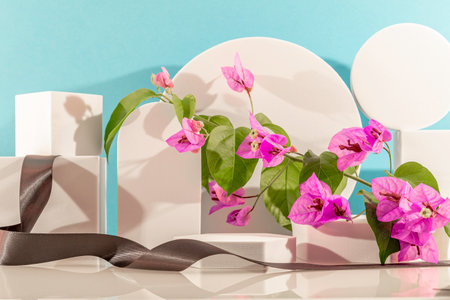 Creative display podium for product presentation with pink bougainvillea flowers.の写真素材