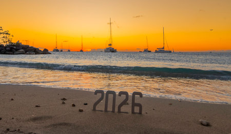 Happy 2026: concept of a new year 2026 with a sunrise on the beach and the figures 2026.の写真素材