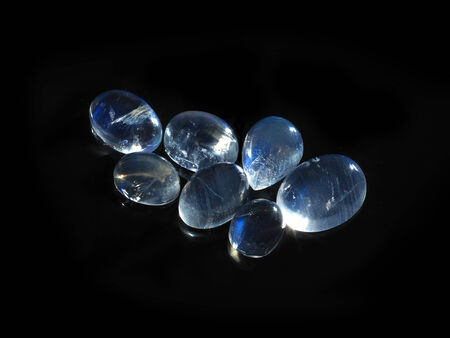 moonstone on black background cut and polishedの写真素材