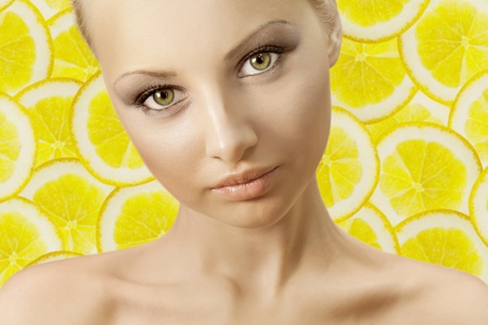 Portrait of a young woman with blonde hair On fruitの写真素材