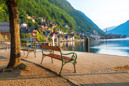 View of the Alpine town of Hallstatt on the shore of a mountain lake at dawnの写真素材
