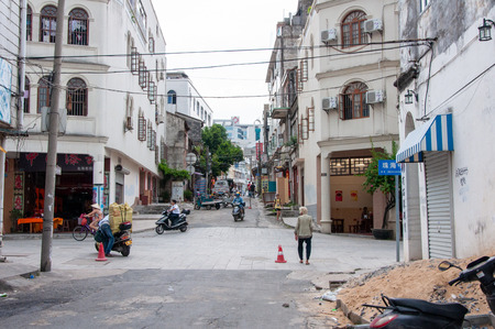 BEIHAI, CHINA - JUN, 2013: Old town street in Beihai, China, with dilapidated houses in the style of colonial architecture.のeditorial素材