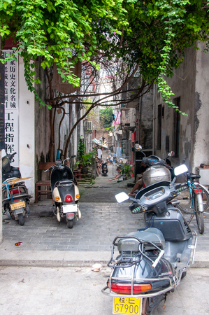 BEIHAI, CHINA - JUN, 2013: Old town street in Beihai, China, with dilapidated houses in the style of colonial architecture.のeditorial素材