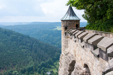 The fortress wall and the tower of an ancient medieval fortress on a cliff above the plains.のeditorial素材