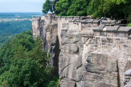 The fortress wall and the tower of an ancient medieval fortress on a cliff above the plains.のeditorial素材