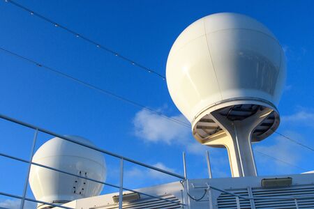 Navigation radar installations of the ship against the blue skyの写真素材