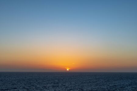 Beautiful sunset over the oceanの写真素材