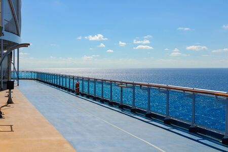 Blue treadmill along the deck of a cruise ship for Jogging while sailing.の写真素材