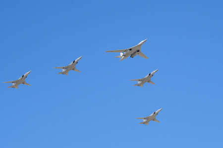 MOSCOW, RUSSIA - JUN 2020: Russian supersonic strategic bomber with a variable sweep wing Tu-160 (Blackjack) and long-range supersonic strategic bomber with a variable sweep wing Tu-22M (Backfire) at the parade in honor of the 75th anniversary of the victのeditorial素材