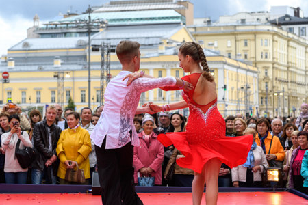 MOSCOW, RUSSIA - SEPTEMBER, 2017: Amateur dancers demonstrate their art of ballroom dancing on the central street of Moscow on City Day. Incendiary Latin American cha-cha.のeditorial素材