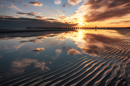 The golden sunset by the sea of Grado, Italy.の写真素材