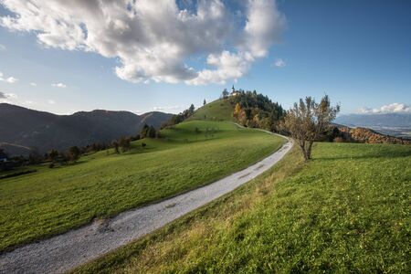 The beautiful fairy hill of Sveti Jakob in autumn at sunset.の写真素材
