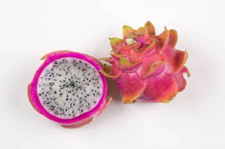 Pitayas / Dragonfruits halves over white backgroundの写真素材