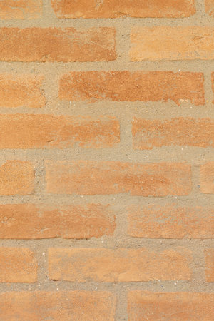 Orange clay bricks wall background. Bricks backdrop.