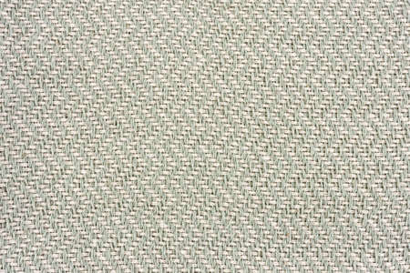 Closeup of light green textile. Fabric details backdrop.