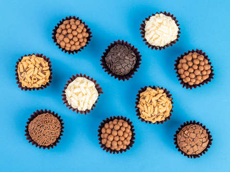 Typical brazilian brigadeiros, various flavors over colorful background.の写真素材