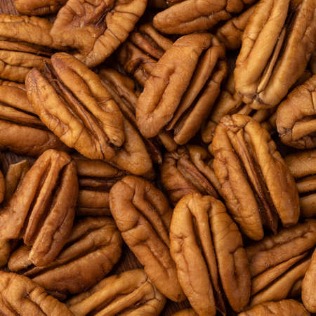 Closeup top view of pecan nuts. Food backdrop.の写真素材