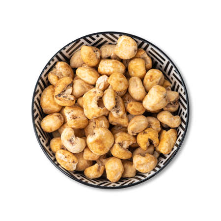 Hominy or white corn popcorn, sweet popcorn in a bowl isolated over white background.