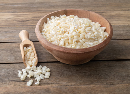 Dried hominy, hominy or white corn on a bowl over wooden table.の写真素材