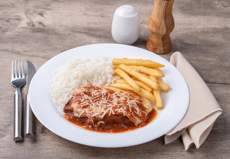 Parmigiana beef, rice and french fries. Typical Brazilian executive dish.の写真素材