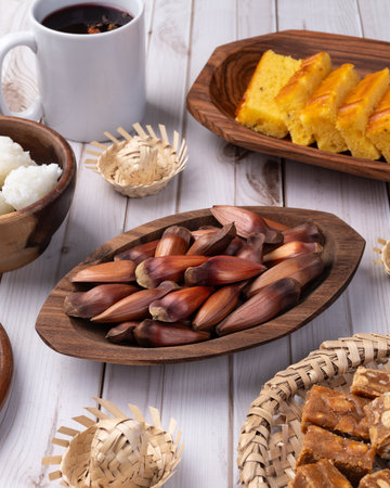 Typical brazilian june festival food over white wooden table. June celebration.