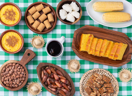 Typical brazilian june festival food over plaid fabric. June celebration.