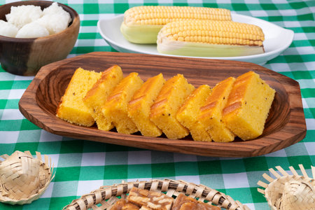 Typical brazilian june festival food over plaid fabric. June celebration.