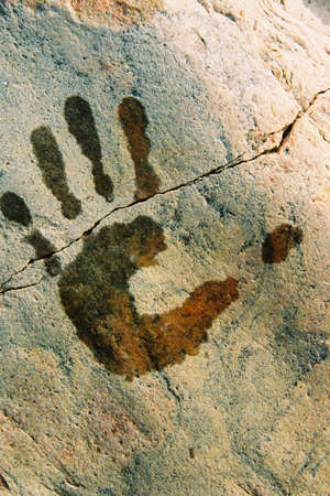 print of hand on the stoneの写真素材