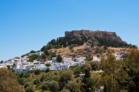 View from the road down to the popular town of Lindos on the Island of Greece Europeの写真素材