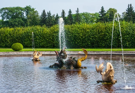 Peterhof Palace St Petersburg, Russia. Golden fish statue fountain in Higher Park. The Peterhof Palace included in the Unesco'S World Heritage listのeditorial素材