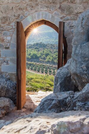 Looking through a gate in beautiful landscapeの写真素材
