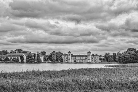 dark clouds over the Castle Rheinsberg - Germany - black and whiteのeditorial素材