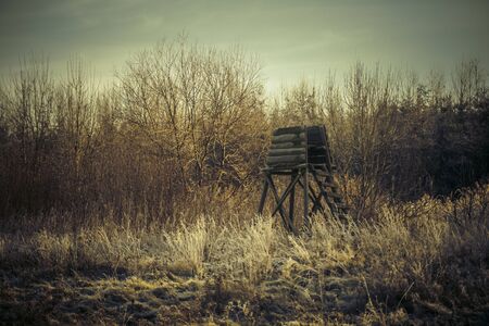 high seat for hunters in winter forest - hunting tower in winter forestの写真素材