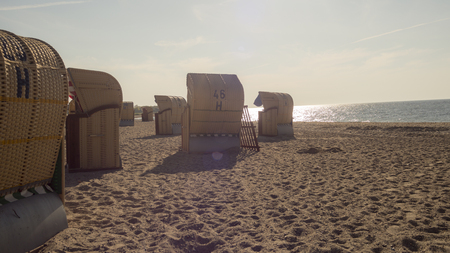 Beach chairs on the Baltic sea beach in sunlightの写真素材