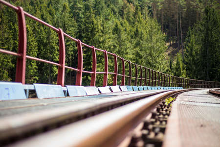 disused railway track and steel bridgeの写真素材
