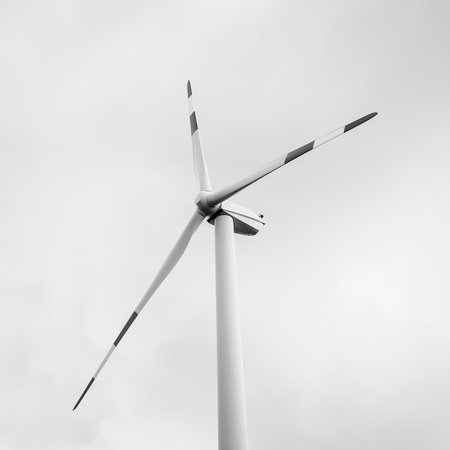 An image of wind turbine generator on a cloudy sky backgroundの写真素材
