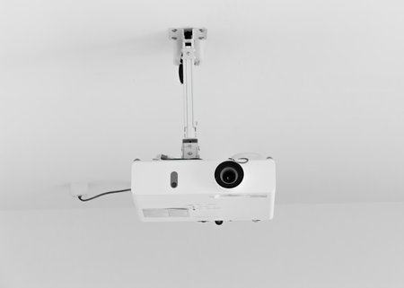 Video projector on a white background. Close up. Studio photography.の写真素材