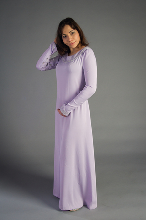 beautiful young girl in a historical dress on gray backgroundの写真素材