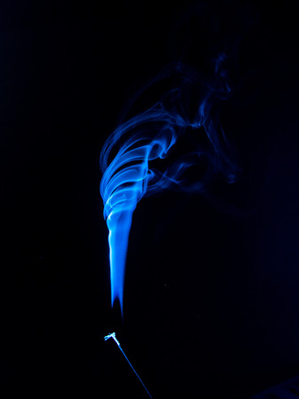 Flowing blue smoke on a black background. Isolatedの写真素材