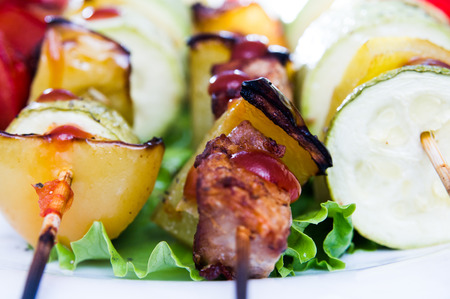 skewers of meat and various fresh vegetablesの写真素材