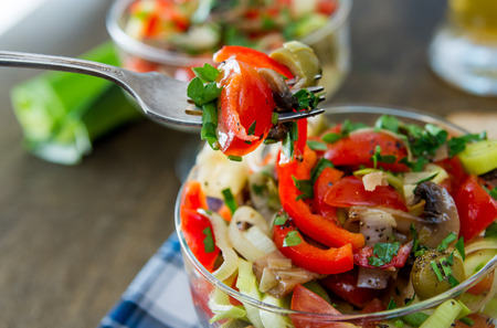 salad with cherry tomatoes, mushrooms, sweet peppers and leeks. Italian foodの写真素材
