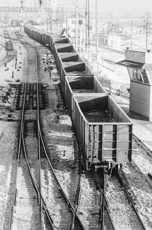 wagons loaded with coal riding the railsの写真素材