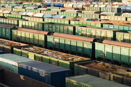 long trains with industrial goods stand on the railsの写真素材
