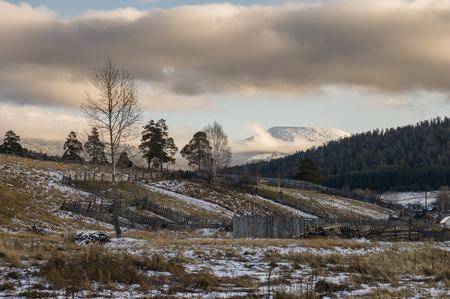The village Tyulyuk is located in a valley at the foot of the mountainsの写真素材