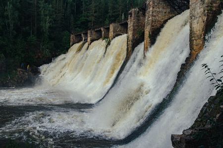 Old dam on a Satka river. Ural.の写真素材