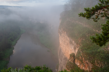 The morning mist rises over the river canyon. Landscapeの写真素材
