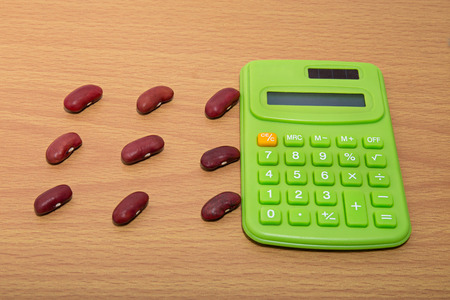 Red kidney beans with calculatorの写真素材